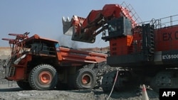 FILE: A truck is loaded with rocks at an Equinox copper mine in Lumwana, Zambia, in this undated handout obtained by Reuters, April 4, 2011.