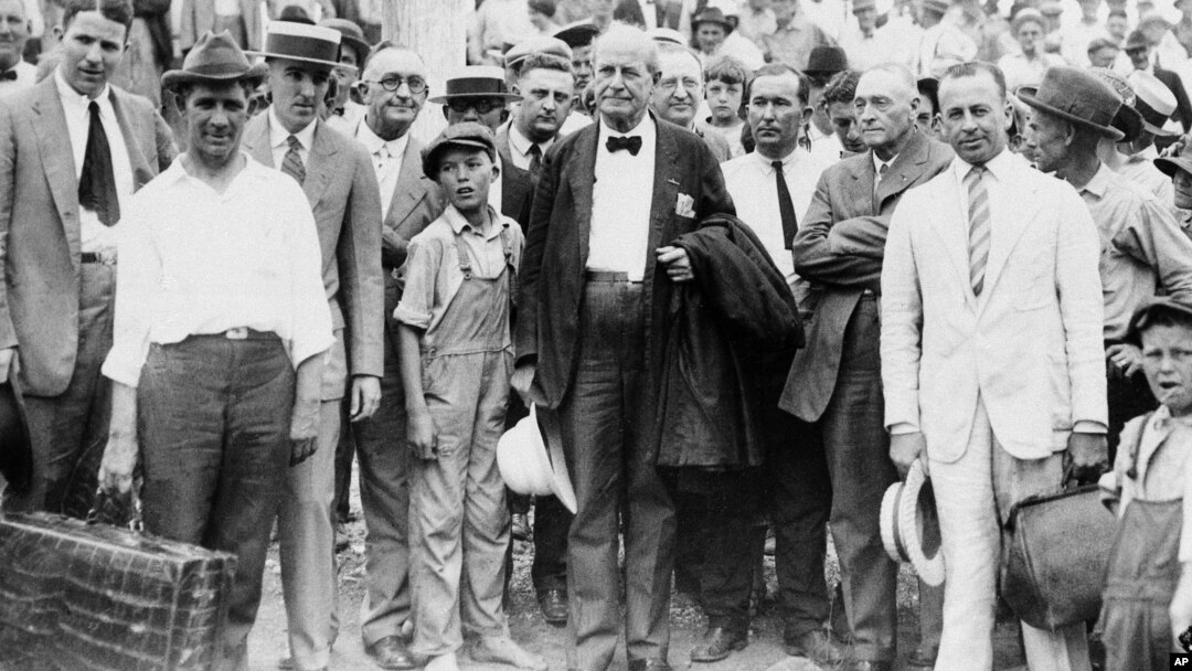 William Jennings Bryan, center, arrives at Dayton, Tenn., in 1925. Bryan, a fundamentalist, is associate prosecutor in the trial of the State of Tennessee vs. John Thomas Scopes, a public school teacher who violated the law when he taught Darwinism.