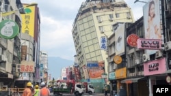 This picture released by Taiwan’s Central News Agency on April 23, 2024, shows the Full Hotel building in Hualien, which had been previously damaged in the April 3 earthquake, tilting further to one side after a series of earthquakes overnight.