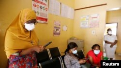 FILE - Members of the contact-tracing team are seen at the Primary Healthcare Center, amid the spread of the coronavirus disease (COVID-19) in Lagos, Nigeria, May 7, 2020.