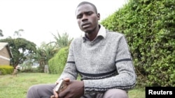 Independent John Paul Mwirigi, who is now a member of the Kenyan parliament, sits outside the tallying center in Maua Girls High School, in Maua, Kenya, Aug. 9, 2017. Mwirigi won the election wearing just one sweater, having no car and not handing out any printed posters.