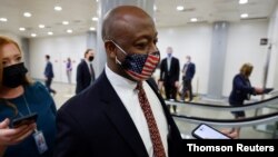 U.S. Senator Scott speaks with reporters as he transits the subway system beneath the U.S. Capitol in Washington, April 27, 2021.