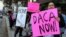 Demonstrators urging the Democratic Party to protect the Deferred Action for Childhood Arrivals Act (DACA) rally outside the office of California Democratic Sen. Dianne Feinstein in Los Angeles, Jan. 3, 2018. 