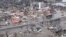 An aerial view of damaged buildings after a storm triggered historic flooding, in Valley, Nebraska, in this still image from a handout video taken March 16, 2019. 