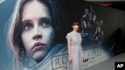 Actress Felicity Jones, who plays Jyn Erso, poses for photographers at the Rogue One: A Star Wars Story fan screening in London, Dec. 13, 2016. At the box office, the film was a top performer for 2016..