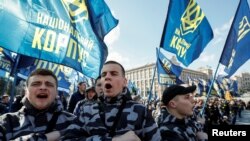 Activists and supporters of the National Corps political party attend a rally to demand an investigation into the corruption of Ukraine's armed forces officials, in Kyiv, Ukraine, March 9, 2019.
