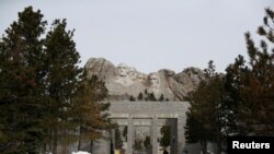 A woman walks at the Mount Rushmore National Memorial as the spread of the coronavirus disease (COVID-19) continues in South Dakota.