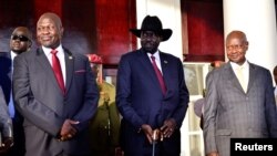 From left, South Sudan opposition leader Riek Machar, South Sudan's President Salva Kiir and Uganda's President Yoweri Museveni pose for a photo at the State House in Entebbe, Uganda, Nov. 7, 2019.