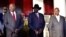 From left, South Sudan opposition leader Riek Machar, South Sudan's President Salva Kiir and Uganda's President Yoweri Museveni pose for a photo at the State House in Entebbe, Uganda, Nov. 7, 2019.