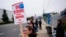 Catherine Minnick, an electrician who has worked for Boeing for six years, works the picket line with fellow union members after they voted to reject a contract offer and strike, Sept. 15, 2024, near the company's factory in Everett, Wash.