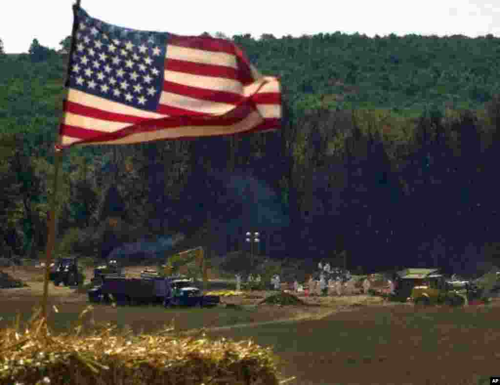 A makeshift altar, constructed for a worship service, overlooks the the crash site of United Airlines Flight 93, Sunday, Sept. 16, 2001, in Shanksville, Pa. The plane was hijacked and crashed during Tuesday's terrorist attacks. (AP Photo/Gene J. Puskar)