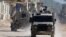 Israeli military vehicles operate during an Israeli raid in Tulkarm, in the Israeli-occupied West Bank, October 31, 2024.