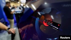 FILE - A data theft alert is displayed on a "threat spiral" at the ProtectWise booth during the Black Hat information security conference in Las Vegas, July 26, 2017.