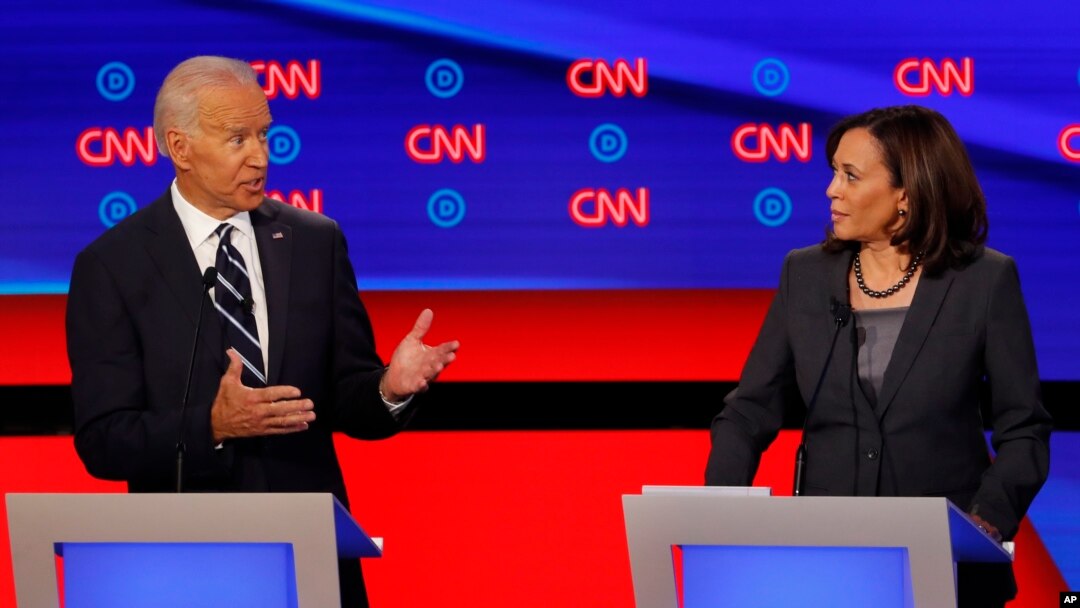 Sen. Kamala Harris, D-Calif., listens as former Vice President Joe Biden speaks during the second of two Democratic presidential primary debates hosted by CNN, July 31, 2019, in the Fox Theatre in Detroit.