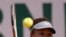 Japan's Naomi Osaka returns the ball to Romania's Patricia Maria Tig during their first round match of the French open tennis tournament at the Roland Garros stadium, May 30, 2021 in Paris.