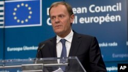 FILE - "If we are to avoid the worst we must speed up our actions," European Council President Donald Tusk says, referring to the migration issue.