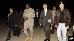 U.S. Vice President Joe Biden, right, walks with the U.S. Ambassador to Iraq James Jeffrey, center, and General Lloyd Austin, the top U.S. commander in Iraq, 2nd left, after his arrival in Baghdad, Iraq, November 29, 2011.