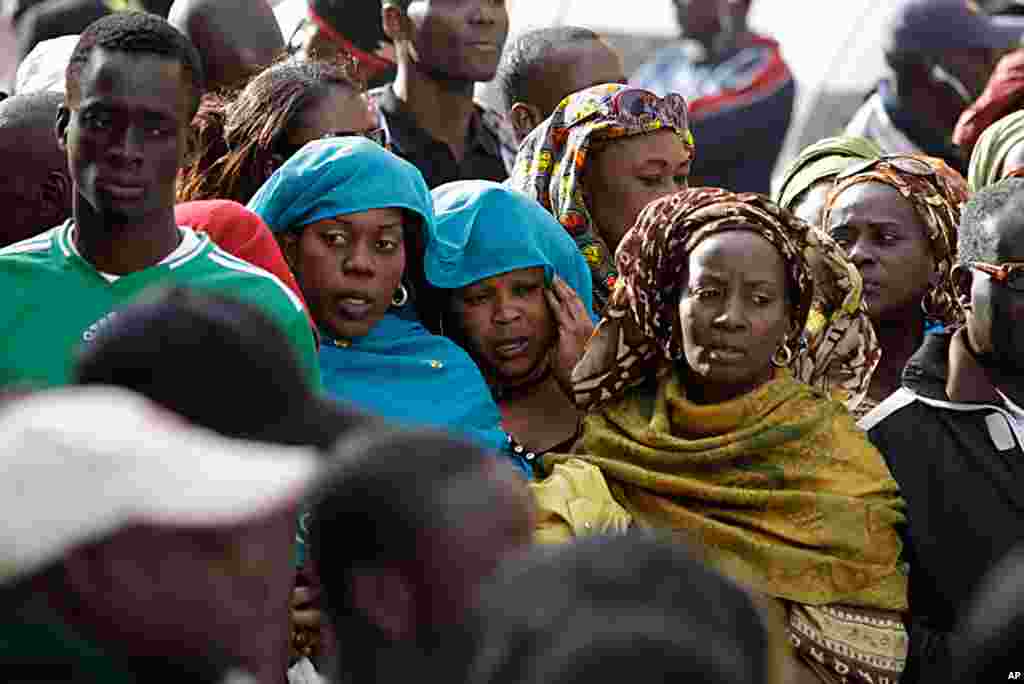 Women participate in a prayer by anti-government protesters on a street leading to Independence Square, where police have blocked the opposition from demonstrating, in Dakar, Senegal Feb. 23, 2012. (AP)