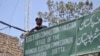 FILE - A policeman stands guard at an Election Commission office in Quetta, Pakistan, May 8, 2013. The Election Commission has twice rejected the registration of Milli Muslim League, citing its alleged terror ties. General elections are scheduled for July 25.