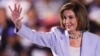 FILE - Former U.S. House Speaker Nancy Pelosi waves during the Democratic National Convention in Chicago, Illinois, Aug. 21, 2024. She had successful emergency hip-replacement surgery on Dec. 14, 2024, after being injuries during a visit to Luxembourg.