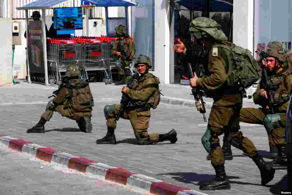 Israeli soldiers secure residential areas in Sderot following a mass-infiltration by Hamas gunmen from the Gaza Strip.