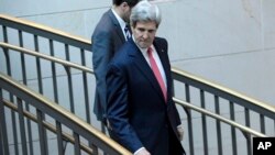 Secretary of State John Kerry walks to a closed-door briefing with Senators on the recent agreement reached between Iran and western powers on Iran's nuclear program, Dec. 11, 2013, on Capitol Hill in Washington. 