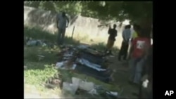 Corpses are seen laid out in Damatura, Nigeria, following a series of coordinated attacks Friday that killed at least 69 people and left a new police headquarters in ruins.