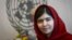 Pakistani activist Malala Yousafzai poses for pictures during a photo opportunity at the United Nations in New York, Aug. 18, 2014. 