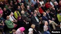 FILE - Delegates pray at the Church of England General Synod, in London, Feb. 10, 2025. 