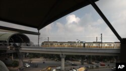 A Delhi metro train arrives at a station on the outskirts of New Delhi, India, Monday, Sept. 7, 2020. India's coronavirus cases are now the second-highest in the world.