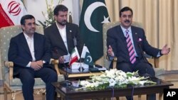 Pakistan's Prime Minister Yousuf Raza Gilani (R) holds meeting with visiting Iranian President Mahmoud Ahmadinejad at the prime minister's house in Islamabad, Pakistan, February 16, 2012.