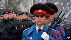 Members of the police forces of Republic of Srpska march during a parade marking the 30th anniversary of the Republic of Srpska in Banja Luka, northern Bosnia.