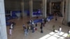 FILE - Travelers walk through a main hall at Israel's Ben Gurion airport near Tel Aviv on Nov. 6, 2024. 