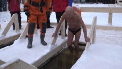 Muscovites Plunge into Icy Water to Celebrate Epiphany