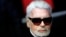 FILE - Fashion designer Karl Lagerfeld poses during the Champs Elysee Avenue illumination ceremony for the Christmas season, in Paris. Nov. 22, 2018.