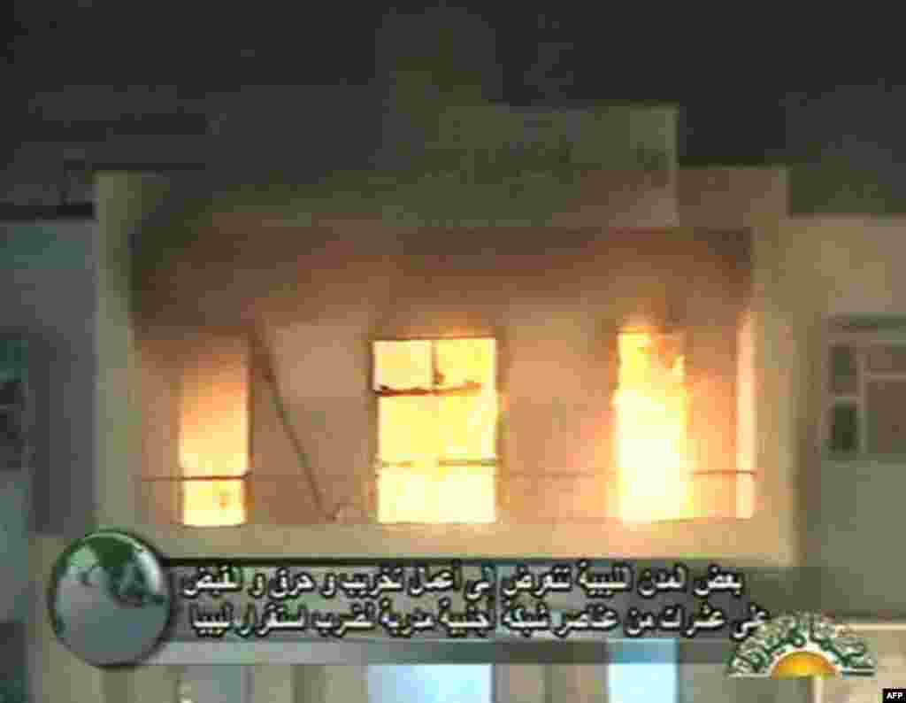 This video image broadcast on Libyan state television Sunday Feb. 20, 2011 shows Al-Bayda local council building on fire in Libya's third biggest city Al-Bayda, on Sunday after days of bloody protests against the government of ruler Moammar Gadhafi. Al-Ba