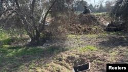 FILE - IDF image shows rocket launchers that the Israeli military says it discovered near a UNRWA school in the area of Bureij in the Gaza Strip.