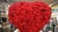 FILE: A big heart made of red roses is on display at the flower show in Essen, Germany. Taken Thurs. Jan. 25, 2018. 
