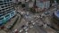 A line of vehicles drive through Shwegontai junction, one of the busiest junctions in the city, in Rangoon, July 3, 2013.