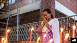 A Hindu woman prays at the Dhakeshwari National Temple in Dhaka, Bangladesh, Aug.11, 2024.