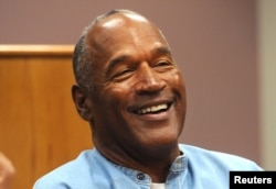 FILE - O.J. Simpson reacts during his parole hearing at Lovelock Correctional Center in Lovelock, Nevada, July 20, 2017.