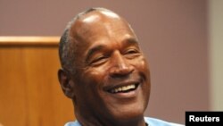 FILE - O.J. Simpson reacts during his parole hearing at Lovelock Correctional Center in Lovelock, Nevada, July 20, 2017. 