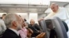 Pope Francis listens to journalist's question as he flies back to Rome following Brazil visit, July 29, 2013.