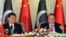 Chinese President Xi Jinping, left, and Pakistan's Prime Minister Nawaz Sharif address reporters at the prime minister's house in Islamabad, April 20, 2015.