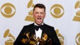 Sam Smith poses with his awards for Best New Artist, Best Pop/Vocal Album for "In the Lonely Hour" and Song of the Year and Record of the Year for "Stay With Me" in the press room at the 57th annual Grammy Awards in Los Angeles, California, Feb. 8, 2015. 