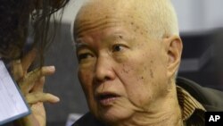 Khieu Samphan, a former head of state for the Khmer Rouge, gestures as testimony is given during his trial at the U.N.-backed war crimes tribunal in Phnom Penh, file photo. 