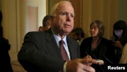FILE - Sen. John McCain talks to the media on Capitol in Washington June 18, 2015.