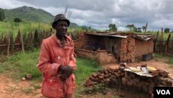 One of the farmers, 71-year old King Maposa, is seen at Manzou farm in Mazowe district, Zimbabwe, March 2, 2018, near what he now calls his bedroom, one that he has to crawl into. He says it has been three years of stress. (S. Mhofu/VOA)