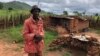 One of the farmers, 71-year old King Maposa, is seen at Manzou farm in Mazowe, Zimbabwe, March 2, 2018, near what he now calls his bedroom, one that he has to crawl into. He says it has been three years of stress. (S. Mhofu/VOA)