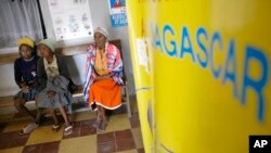 FILE - Malagasy women wait to be seen by a doctor in a clinic in Antananarivo, Madagascar.